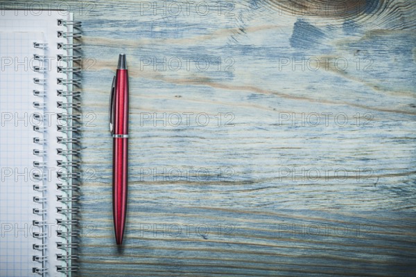 Blank note-books biro pen on wooden board copy space office concept