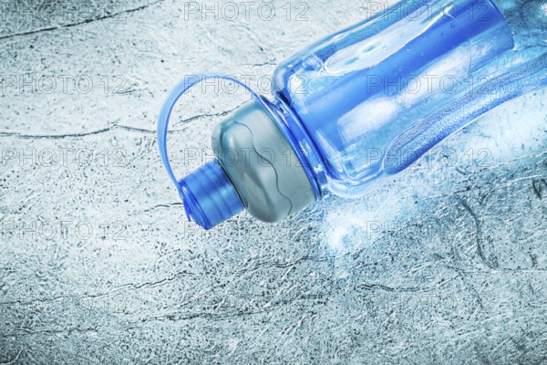 Water bottle for doing sports on silver background fitness concept