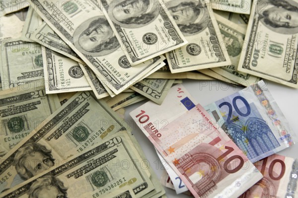 Dolar versus euro notes, finance metaphor image