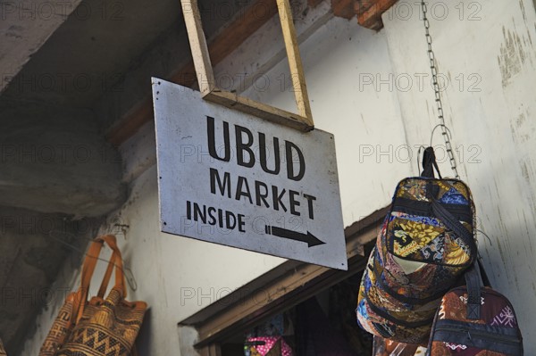 Ubud market sign, some bags and part of the entrance door