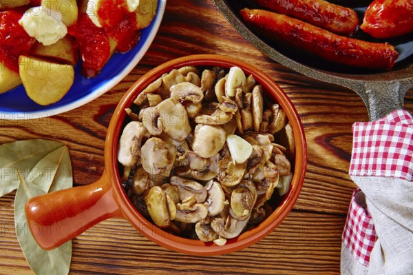 Tapas from Spain champinones mushrooms with potatoes and sausage
