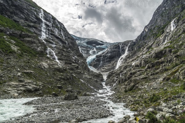 The Kjenndalsbreen is part of the Jostedalsbreen, one of the largest glaciers in Norway, and forms an impressive mountain landscape. The glacier Kjenndalsbreen in Norway is a beautiful place to travel to in summertime