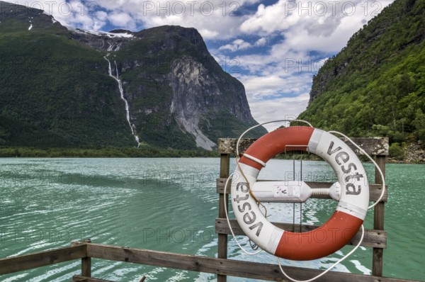 The Kjenndalsbreen is part of the Jostedalsbreen, one of the largest glaciers in Norway, and forms an impressive mountain landscape with a beautiful lake in Sande. The glacier Kjenndalsbreen with a lake in Norway is a beautiful place to travel to in summertime