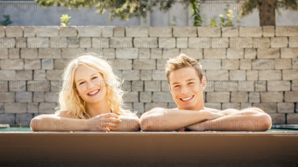 An image of a young couple at the pool