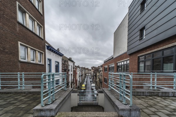 Belgium, 03 15 2019: The symmetric diagonal staircase of the dead end Auguste Snieder street with a view on traditional residential houses, Europe