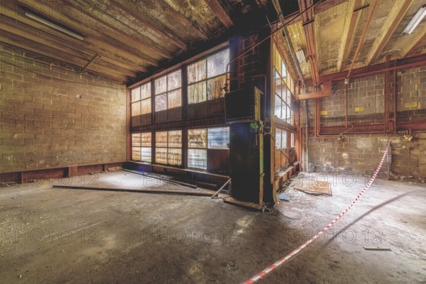 Interior of an abandoned building with wooden floor, rubble and light coming in through high windows, HF6, Lost Place, Seraing, Province of Liège, Belgium, Europe