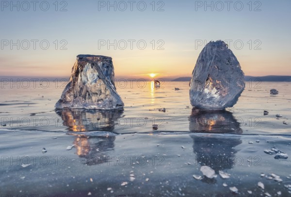 Sunset on frozen Lake Baikal landscape, sunlight is refracted in pieces of ice
