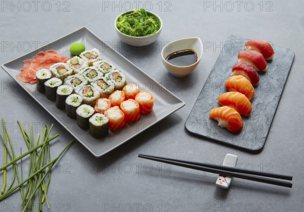 Sushi Maki and Niguiri California roll with seaweed chuka salad soy sauce and wasabi