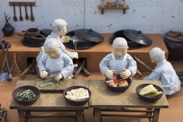 Korean monk figures preparing traditional korean food