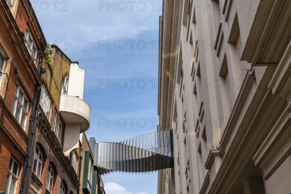 London, UK, May 15, 2019: Modern design bridge between two buildings in Covent Garden. Located in the West End of London, Covent Garden is renowned for its luxury fashion and beauty stores, restaurants and theatres