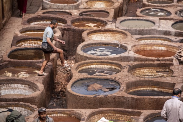 FES, MOROCCO, ARIL 10, 2023, Famous tannery in the medina of Fes, where leather is being processed for generations, Morocco, Africa