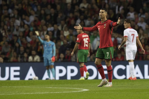Football match, captain Cristiano RONALDO CR7 Portugal right with raised arms and looking to the left with the view to the referee not in the picture and with view saying so it does not go, in the background goalkeeper Diogo COSTA Portugal, Joao NEVES Portugal and Kacper URBANSKI Poland to see, Estadio do Dragao, Porto, Portugal, Europe