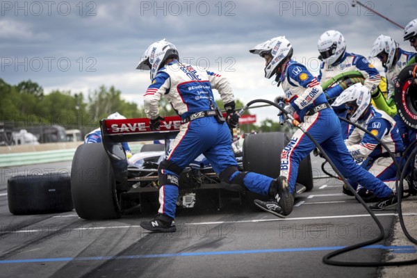 LINUS LUNDQVIST (R) (8) of Stockholm, Sweden comes down pit road for service during the XPEL Grand Prix at Road America in Elkhart Lake, WI