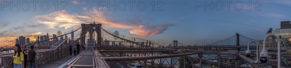 Night coming over famous Brooklyn Bridge, New York City, USA, North America