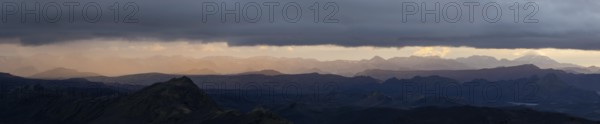 Cloudy mood and evening light at sunset, view from Mount Sveinstindur, volcanic landscape, panoramic shot, mountains, Icelandic highlands, Iceland, Europe