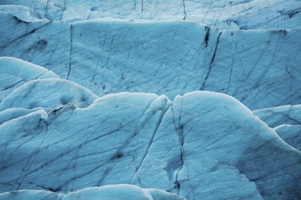 Detailed close-up of a glacier's textured surface with deep blue tones, iceberg, glacier, snow, ice rock, ice diamont, glacier lagoon, nature, snow, diamont beach, Iceland, Europe