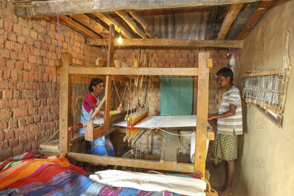 Woman weaving clothes on handloom, bastar, chhattisgarh, india, asia