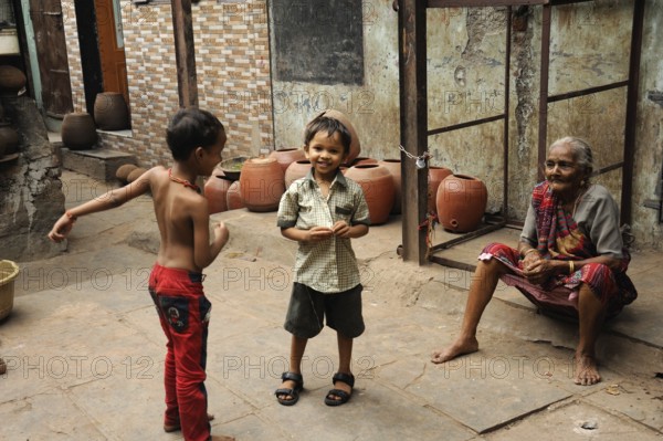 Child playing dharavi slum, mumbai, maharashtra, India, Asia