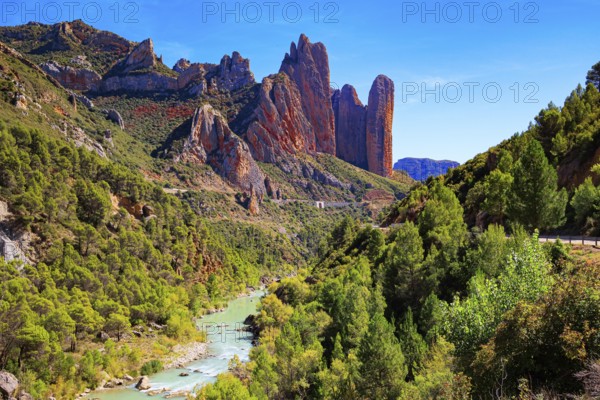 The picturesque river Gallego flows through the gorge. Beautiful rocks - part of the foothills of the Pyrenees. The magnificent Mallets of Riglos. Romantic trip to Spain. Aragon