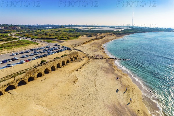 Mediterranean coast. The sandstone aqueduct built during the reign of Herod the Great. January sunny warm and clear day. Aerial view photos. Caesarea. Israel