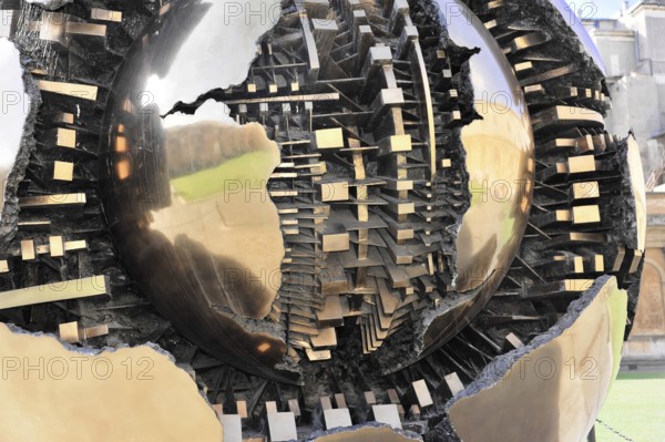 Mappa Monda, Sfera con Sfera, Globe, Palazzetto del Belvedere, Cortile della Pigna, Vatican Museums, Vatican, Rome, Lazio, Italy, Metallic globe in the midst of people on a square in front of a building, Rome, Lazio, Italy, Detailed view of metallic and reflective structures of a sculpture, Vatican, Rome, Lazio, Italy, Europe