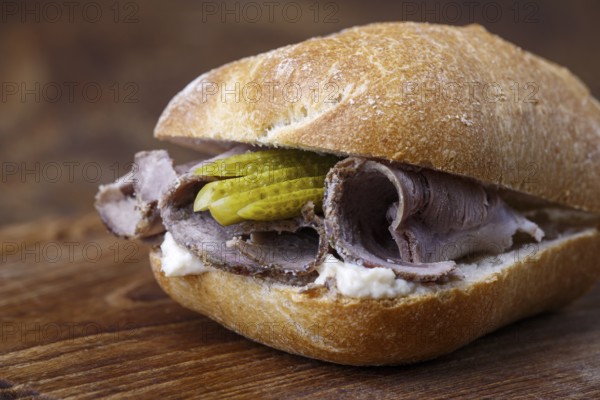 Cold roast pork in a roll