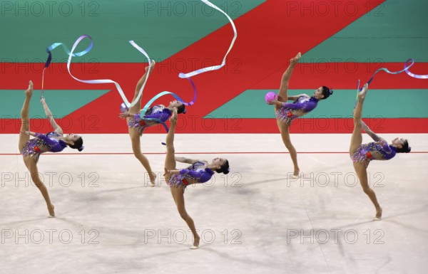Sofia, Bulgaria - 16 September, 2022: Members of team China in action with 2 balls and 3 ribbons during the 39th FIG Rhythmic Gymnastics World Championships
