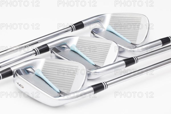 Titanium golf clubs on the white background
