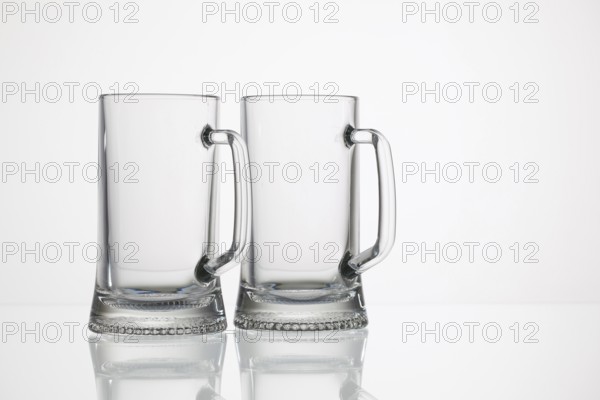 Empty glasses of beer on the glass desk
