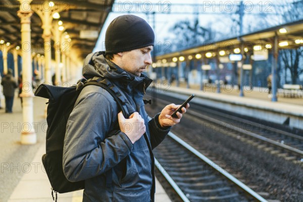 Sopot Railway station. traveler waiting for transportation. Travel concept. Man at the train station. Portrait Of Caucasian Male In Railway Train Station. Handsome commuter while waiting for his train
