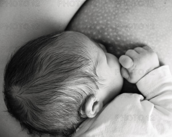 Mother breast feeding her baby