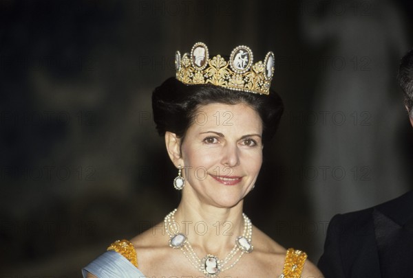 Queen Silvia of Sweden. Wife of the current king of Sweden, Carl XVI Gustaf. Pictured 1992 in the cameo tiara, which she first wore on her wedding day in 1976. The tiara has been attributed to the jeweller Nitot (now @chaumetofficial) and is often said to have belonged to Empress Joséphine of the French. At the Napoleonic court, cameo tiaras were typically worn during the day, while tiaras with diamonds, sapphires, emeralds, rubies and other gemstones were expected to be worn at night. Around 1836, Auguste Amalie appears to have given it to her daughter Josephine, later Queen of Sweden and of Norway, who left it to her daughter, Princess Eugénie, who left it to her nephew, Prince Eugen, who in 1932 gave it to his great-nephew's bride, Princess Sibylla. After her hair went white Sibylla did not find the tiara very becoming and rarely wore it, but her daughters Birgitta and Désirée wore it on their wedding days in 1961 and 1964. In 1976, the groom's sisters suggested that Silvia should a...