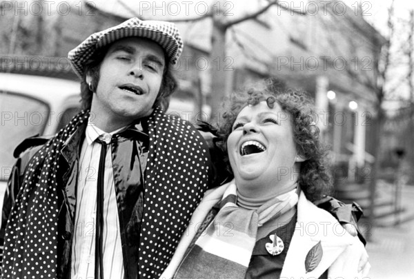 Elton John. English singer, songwriter born march 25 1947. Pictured wearing a chequered cap and a matching chequered scarf during a visit to Sweden 1978