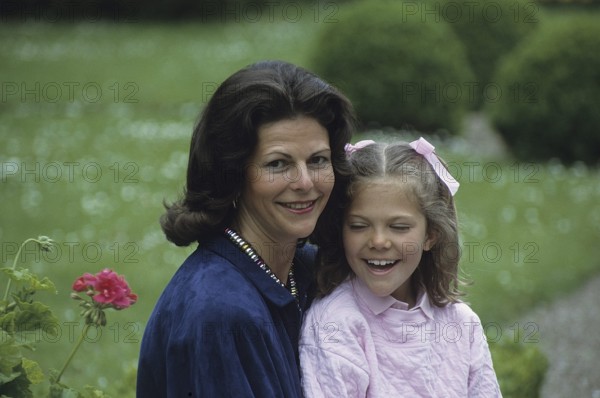 Queen Silvia of Sweden with her daughter crown princess Victoria on the grounds of Solliden castle 1985
