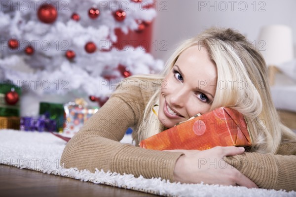 A young woman geting the Christmas gift