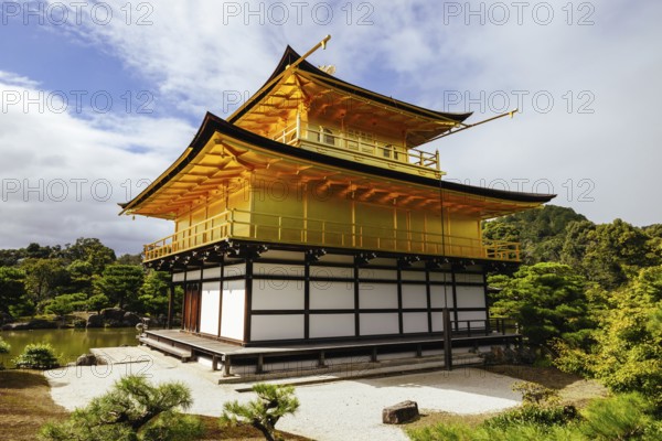 The world famous Kinkakuji Temple (The Golden Pavilion) in Kyoto, Japan on a warm autumn morning