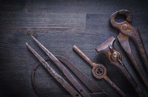 Set of vintage tools on wood board