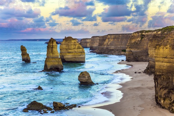 Early morning on the ocean coast. The clouds over the well-known rocks Twelve apostles. Travel to Australia. Concept active, ecological and phototourism