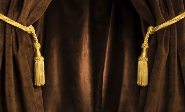 Brown theatre curtain and yellow tassels