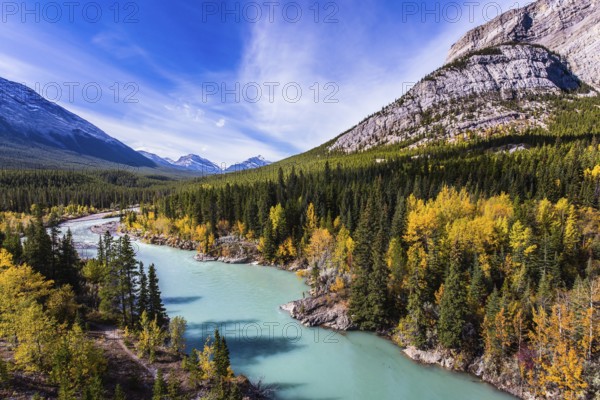 Abraham Lake is the most beautiful lake in the Rockies. Dense forests cover the lake shores. Warm sunny day in autumn. The concept of ecological and active tourism