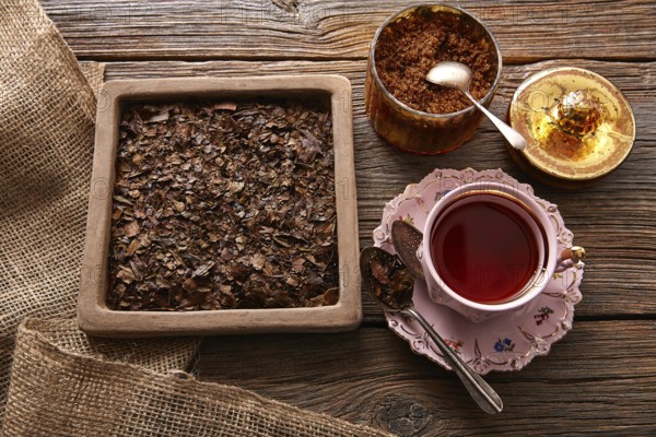 Bancha tea served pink vintage cup on wooden table board