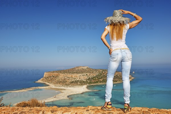 A beautiful woman over the beach Balos of Creta, Greece, Europe