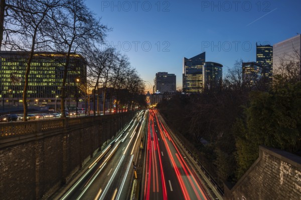 Saint Josse, Brussels Capital Region, Belgium, Feb. 08 2023, Cityscape view over the business district with the light trails of traffic at the central boulevard tunnel, Europe