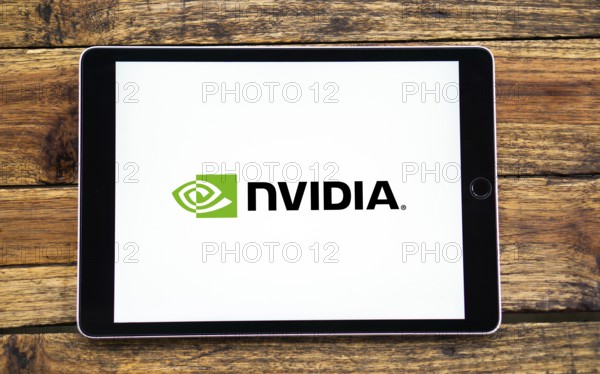 Nvidia logo on smartphone screen with AI in the background. Nvidia Corporation is an American multinational corporation and technology company
