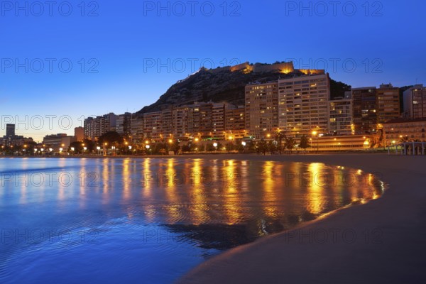 Alicante skyline at sunset from Postiguet beach in spain