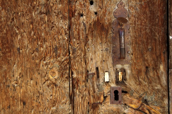 Aged wood door grunge texture rusty handle vintage wooden detail