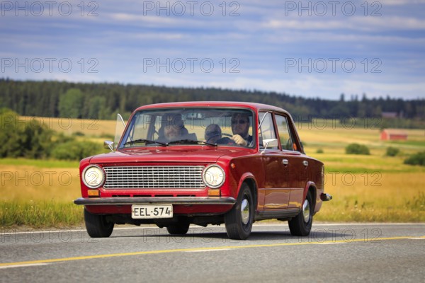 Driving red Lada 1200 on Maisemaruise 2019 car cruise. Lada 1200 was manufactured by the Russian AvtoVAZ in 1970-88. Vaulammi, Finland. Aug 3, 2019