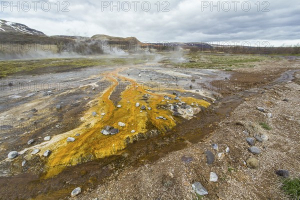 Colorful rock at the geothermal field around Haukadalur geyser, Iceland, Europe