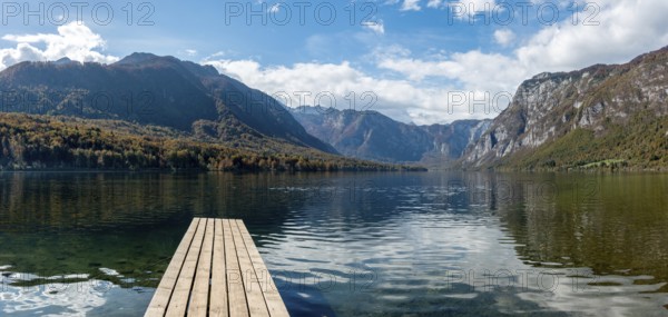 Scenic view of a small wooden jetty at lake Bohinj in the Triglav National Park, The Julian Alps, Slovenia, Europe