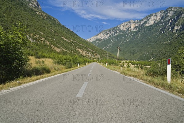 Vjosa river valley main road to the city of Permet during summer without any cars driving